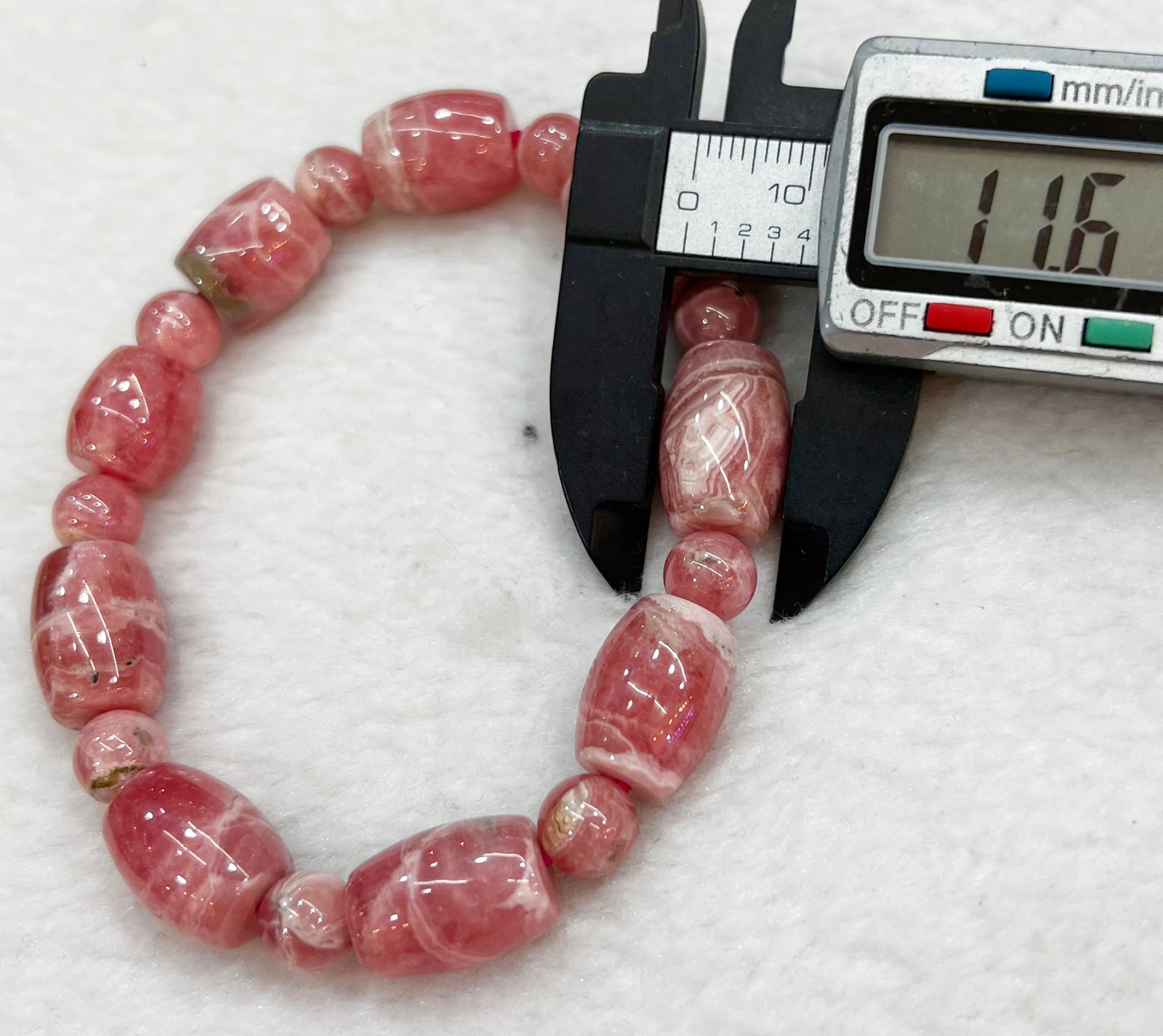 Armband aus Naturstein perlen Rhodachrosit zieht Steine an